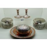 A lot comprising six pieces of Cairo ware - a pair of candlesticks, a plate, lidded bowls