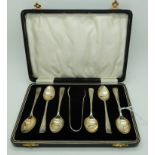 A cased set of six silver coffee spoons with tongs, Birmingham 1931 Condition Report: Available upon