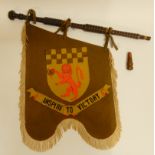 A lot comprising assorted bag pipe drones together with a banner bearing the words Inspire to