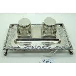 A silver double inkstand with pierced decoration Sheffield 1909 20.5 cm x 12.2 cm 312 grams