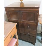 A mahogany tallboy with two doors over three drawers, 108cm high x 70cm wide x 50cm deep Condition