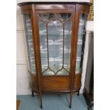 An Edwardian mahogany display cabinet with single door and two curved glass side panels, 176cm