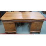 A mahogany and walnut pedestal desk with three carved frieze drawers and two doors, 80cm high x