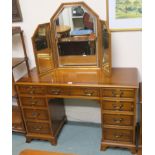 A Bradley furniture yew wood pedestal desk/dressing table, 77cm high x 122cm wide x 47cm deep,