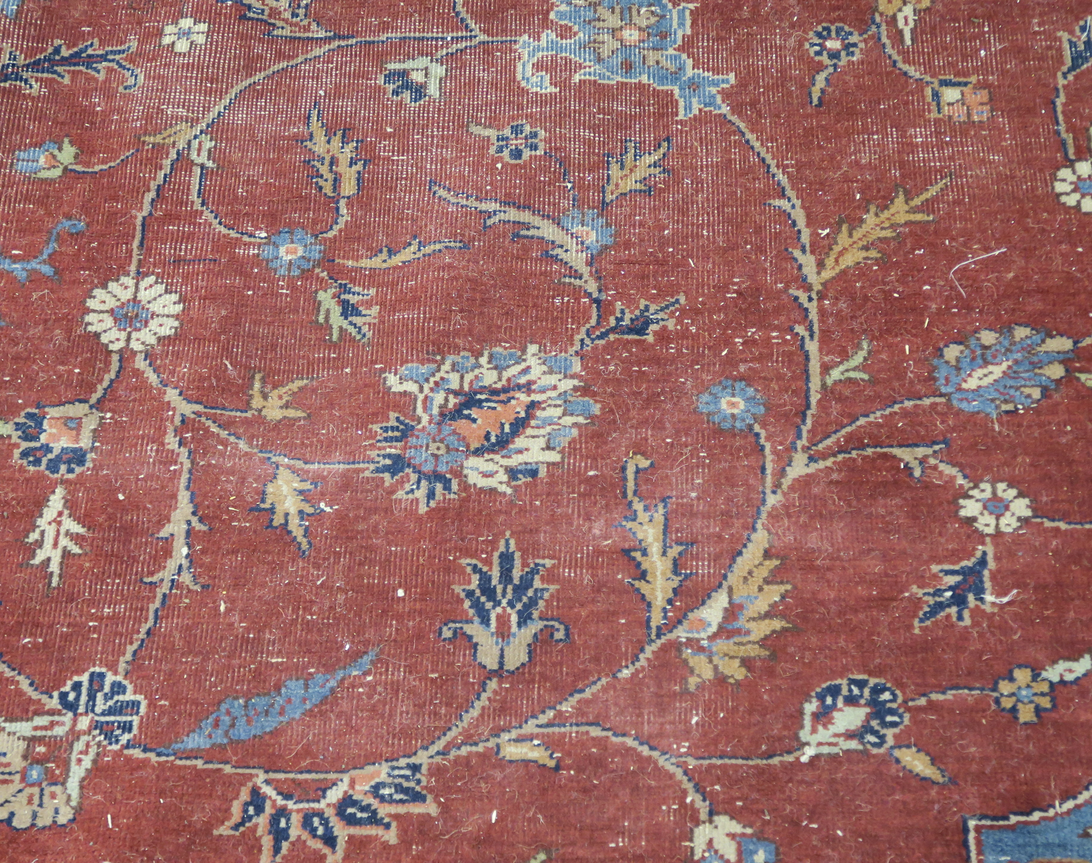 A large Turkish tabriz rug, red ground with central medallion and spandrels with animals and birds - Image 8 of 8