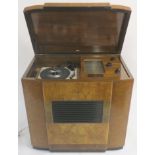 An RGD radiogram in walnut cabinet with radio and replacement turntable, 81cm high x 84cm wide x