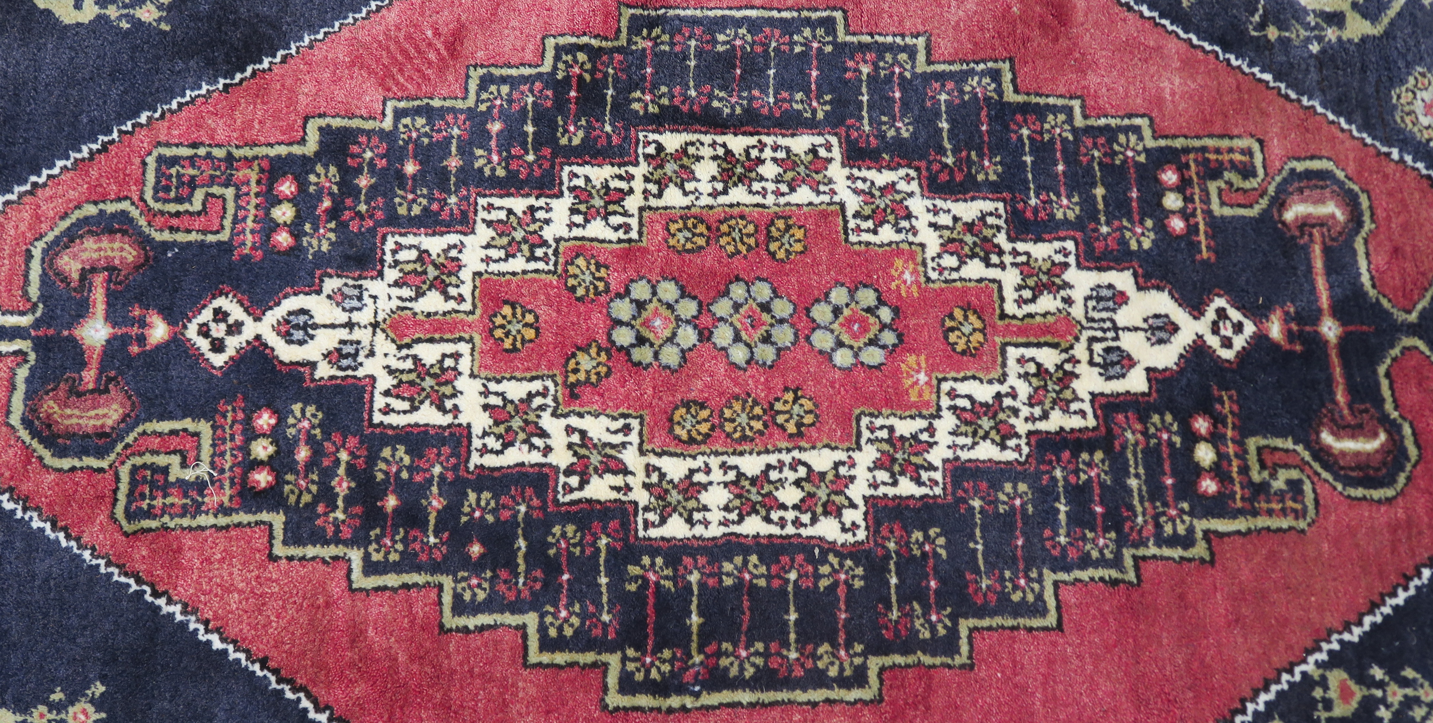 A blue ground Turkish Anadol wool rug with geometric design within a cream border, 250cm x 156cm - Image 2 of 6