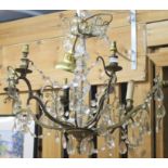A six branch brass chandelier with glass droplets Condition Report: Available upon request
