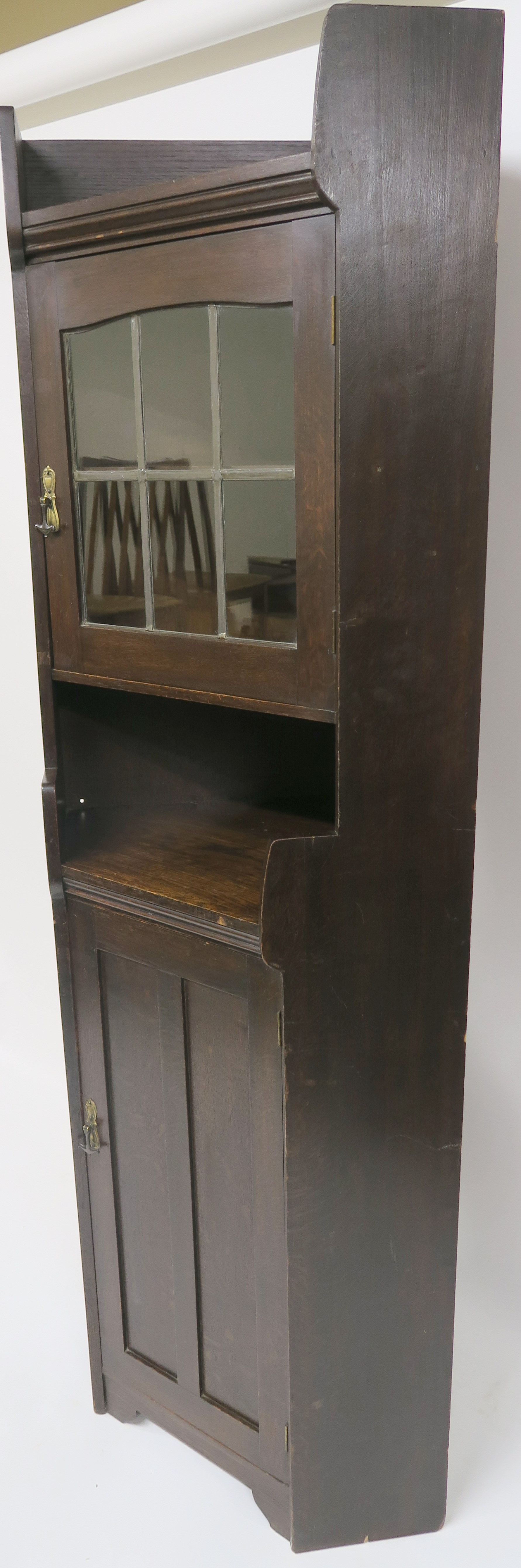 A Liberty & Co oak corner cabinet, the upper section having leaded glazed door over open shelf on - Image 7 of 8