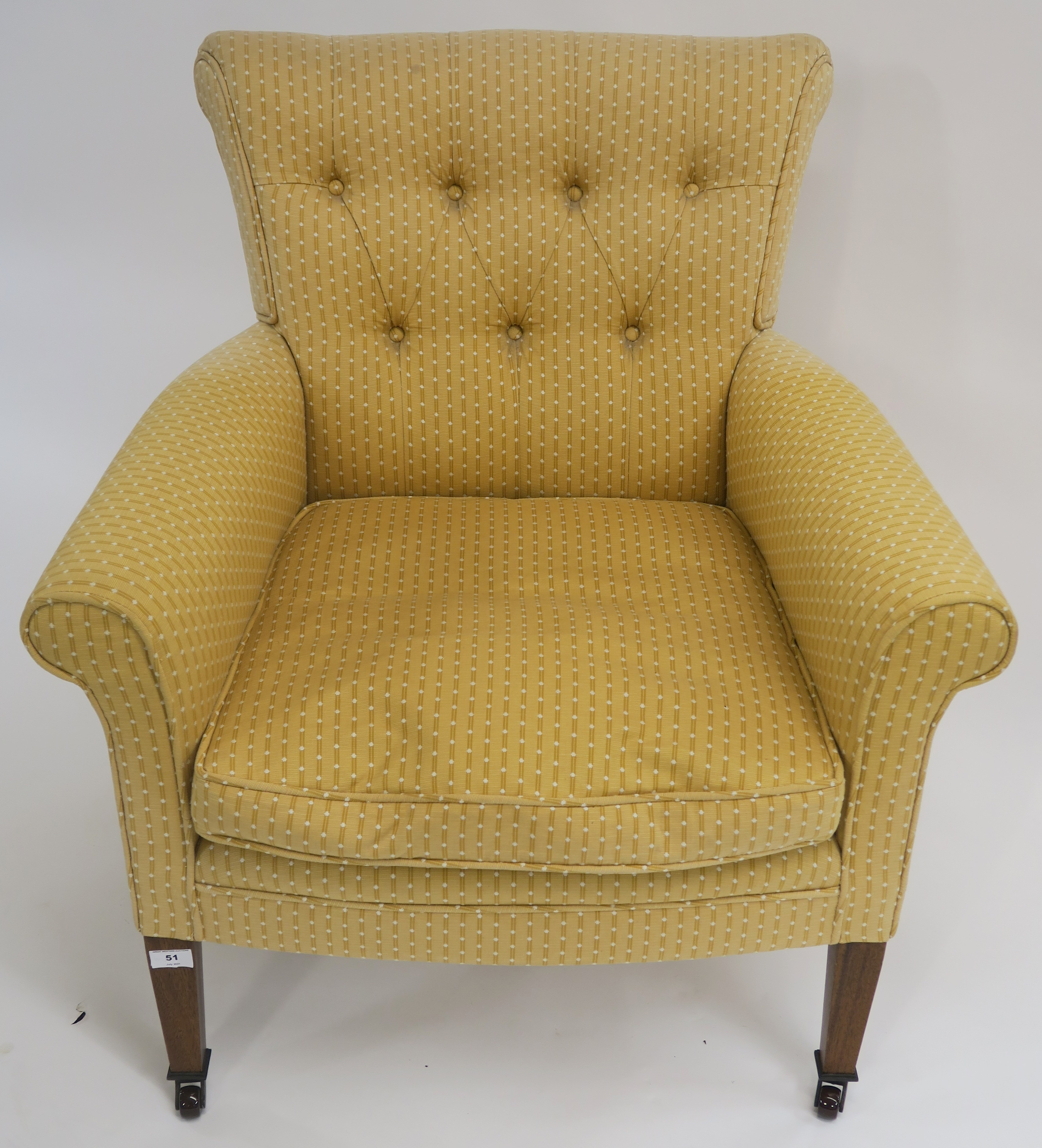 A yellow button back upholstered armchair with square tapering legs on ceramic castors, 84cm high - Image 2 of 2