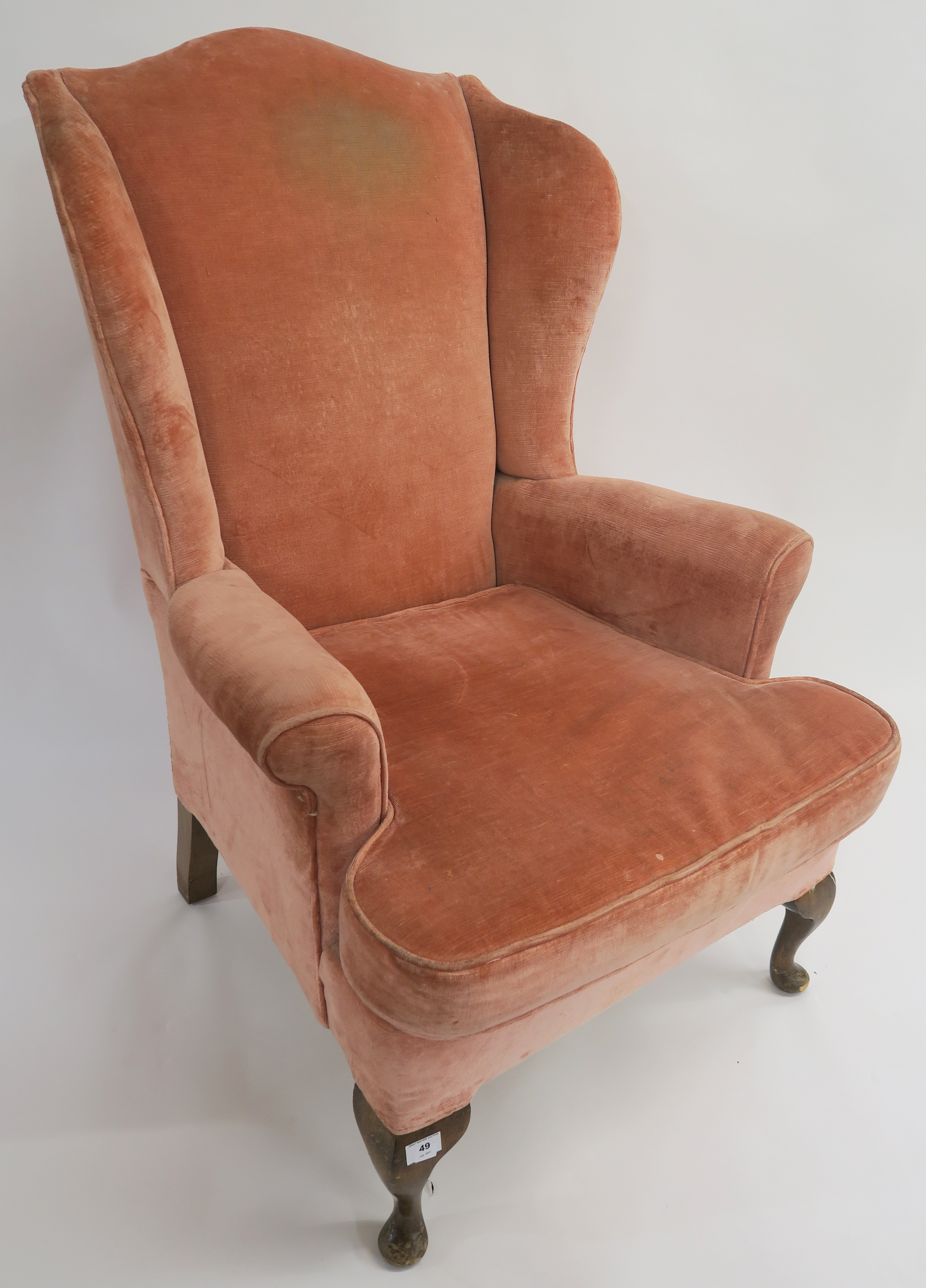 A pink upholstered wing back armchair, 114cm high Condition Report: Available upon request