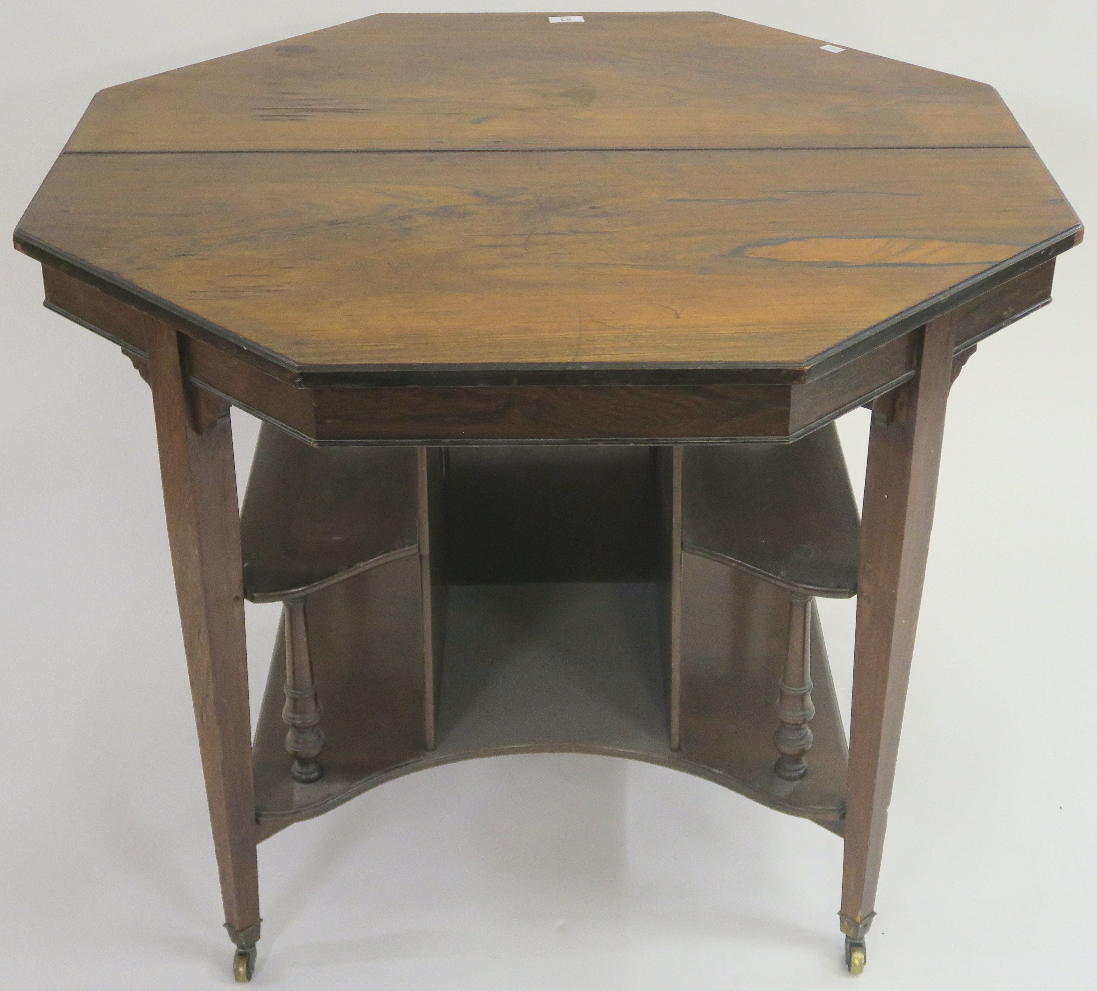 A Victorian rosewood octagonal table with lower shelves, 72cm high x 90cm wide x 90cm deep Condition