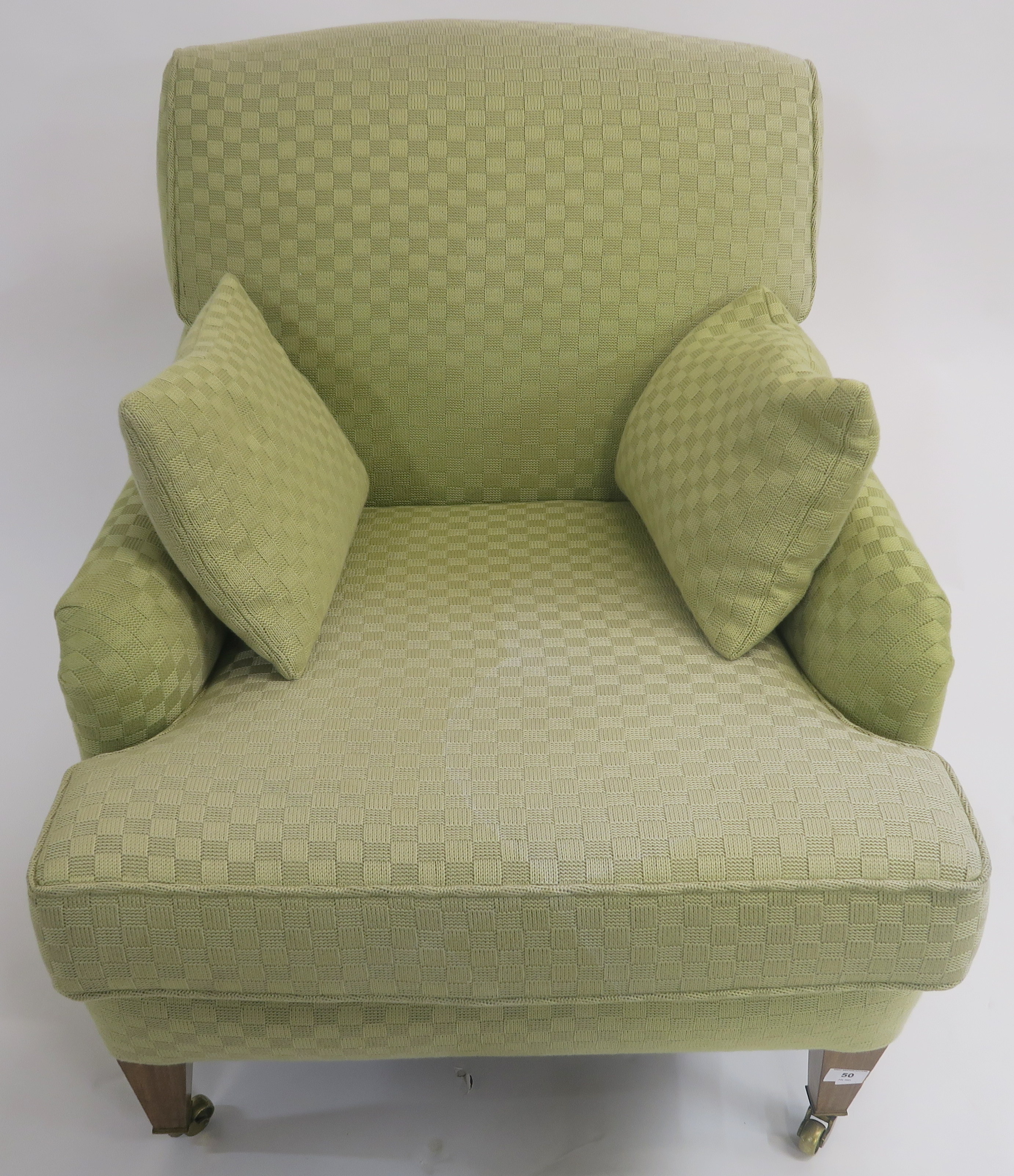 A green upholstered armchair on square tapering legs with brass castors, 84cm high Condition Report: - Image 2 of 2