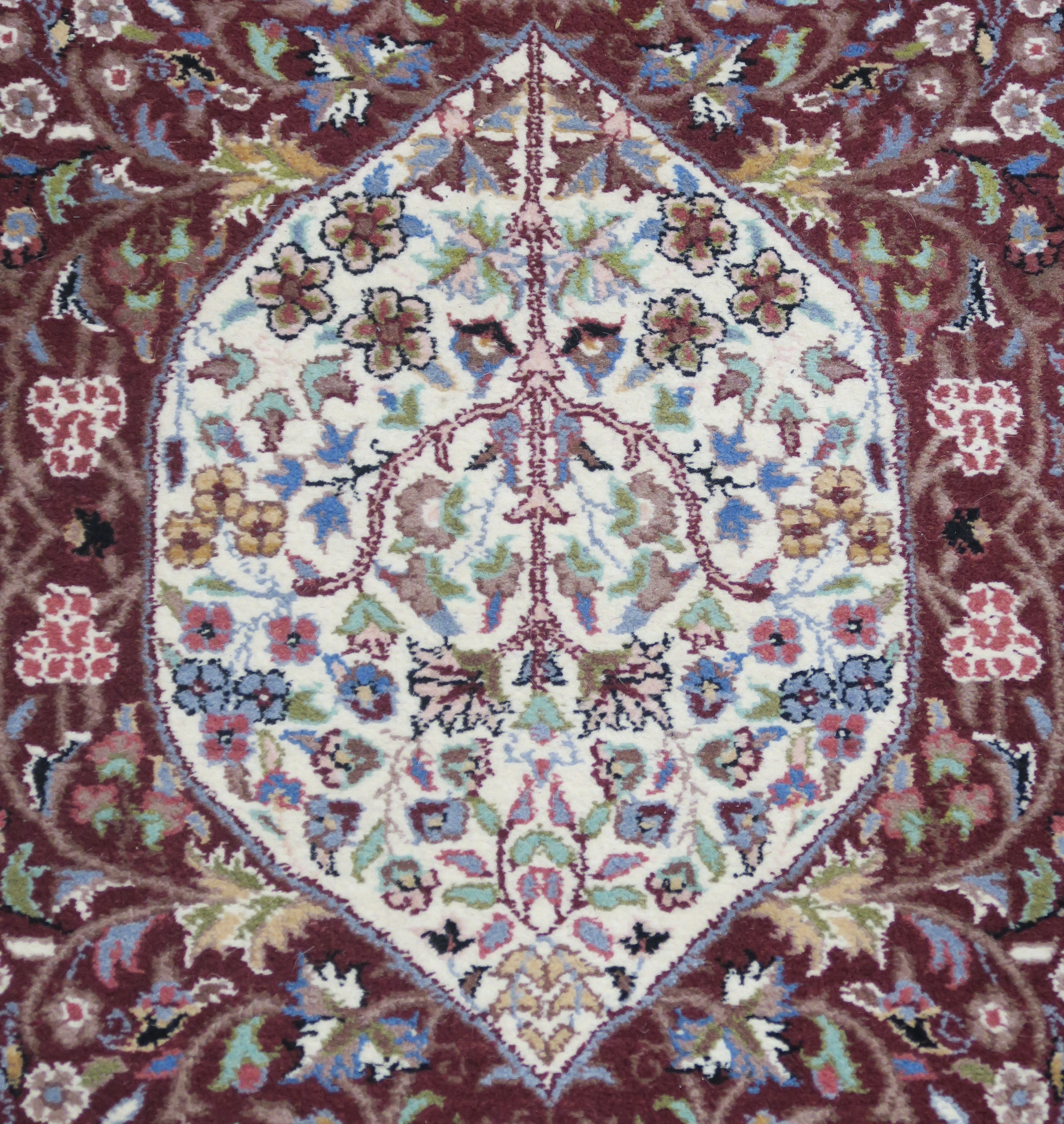 A modern burgundy ground wool rug with cream central medallion and border, 160cm x 97cm and a - Image 2 of 4