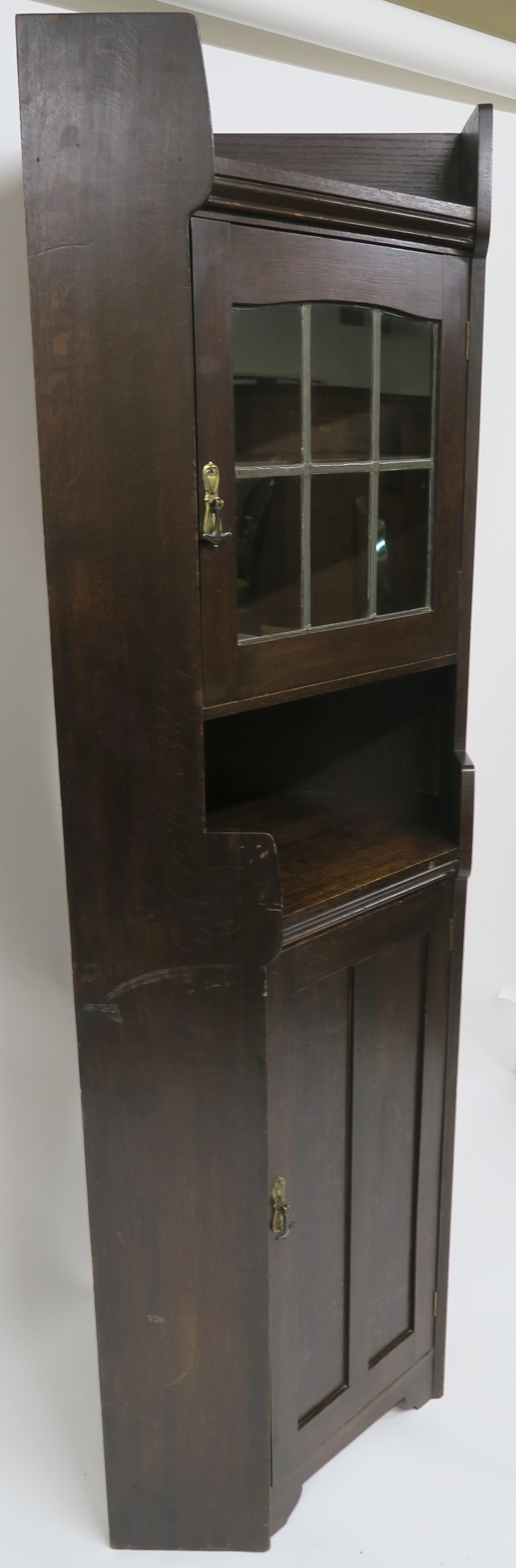 A Liberty & Co oak corner cabinet, the upper section having leaded glazed door over open shelf on - Image 8 of 8