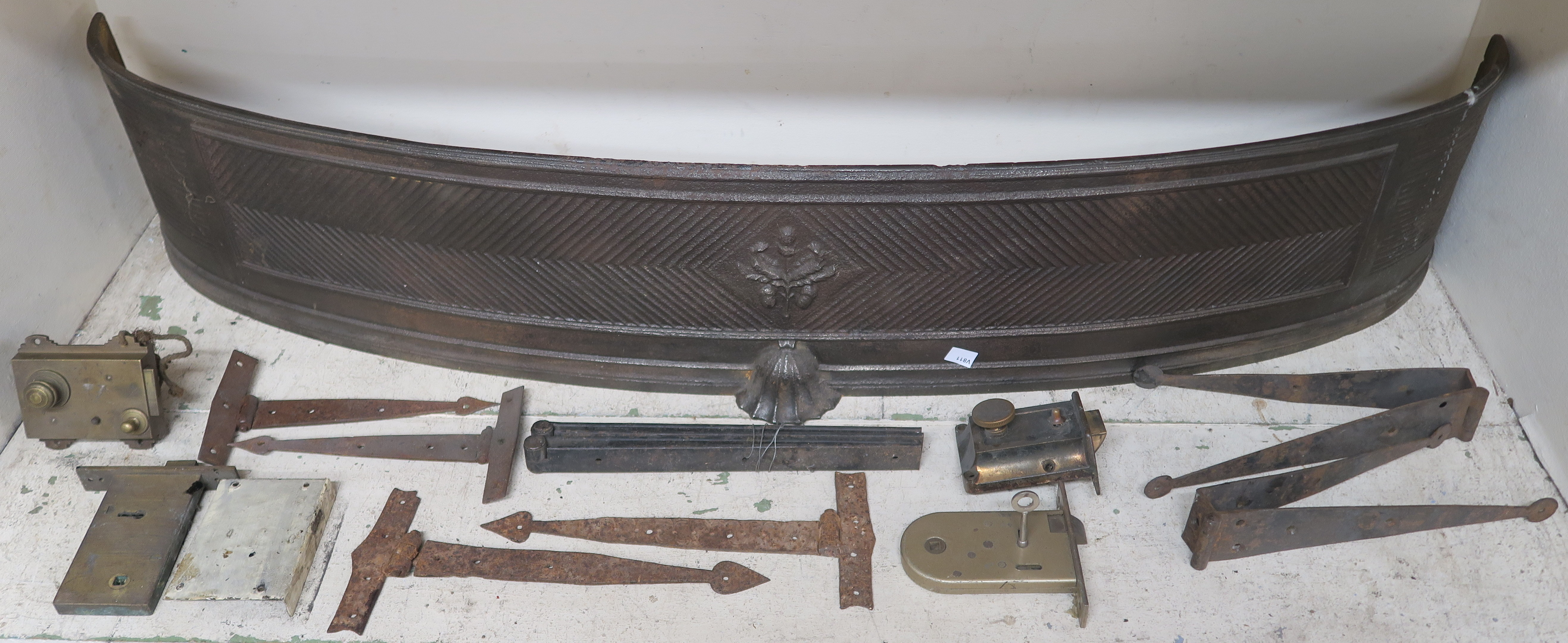 A cast iron bow front fender, 23cm high x 120cm wide. A metal deed box and a selection of locks - Image 2 of 2