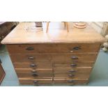 A pine plan chest with two full width drawers over eight drawers and cast iron pull handles, 94cm