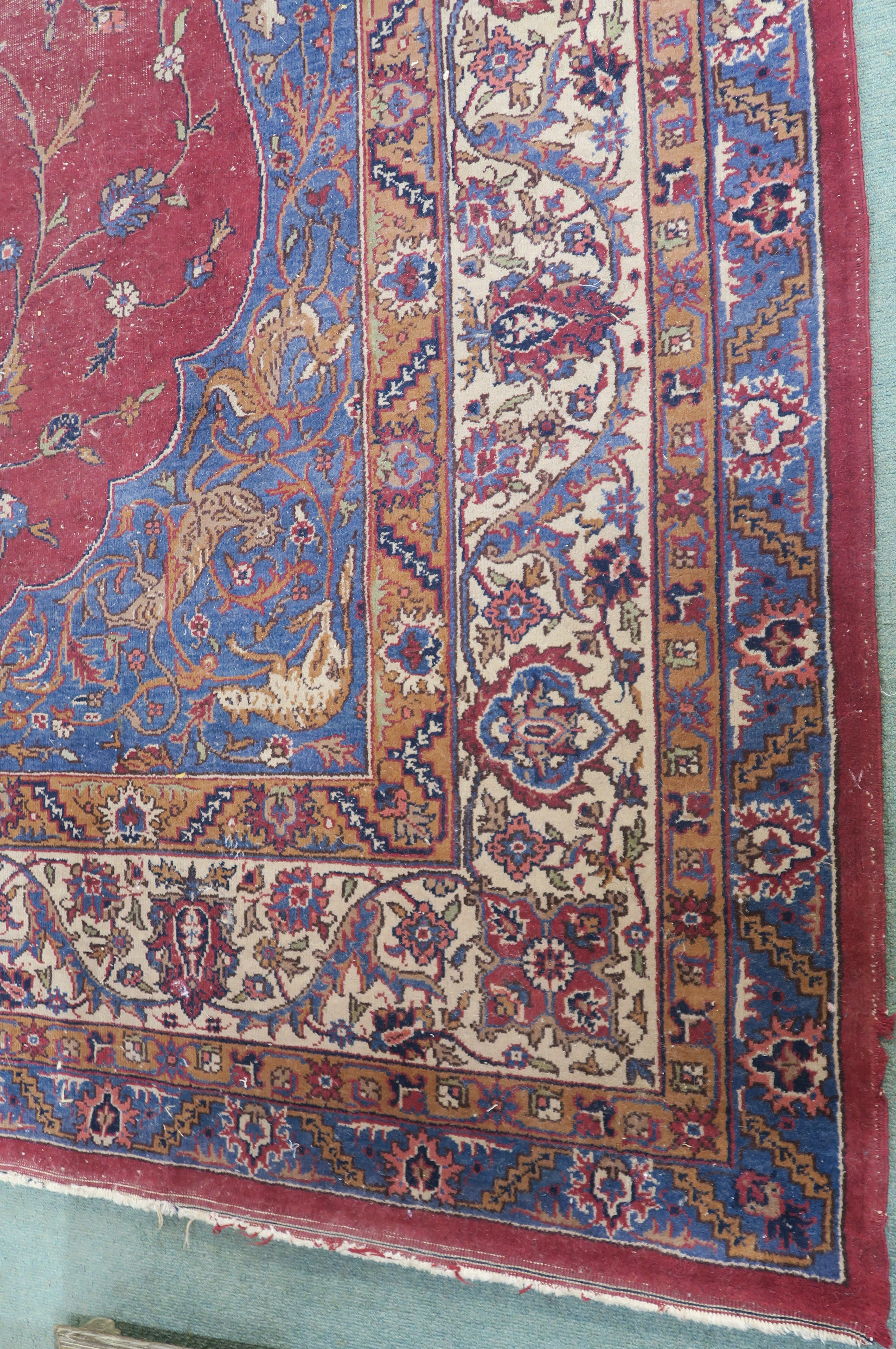 A large Turkish tabriz rug, red ground with central medallion and spandrels with animals and birds - Image 4 of 8