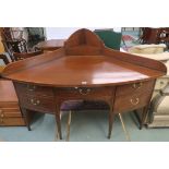 A large 19th Century corner cabinet with central drawer flanked by two doors on square tapering