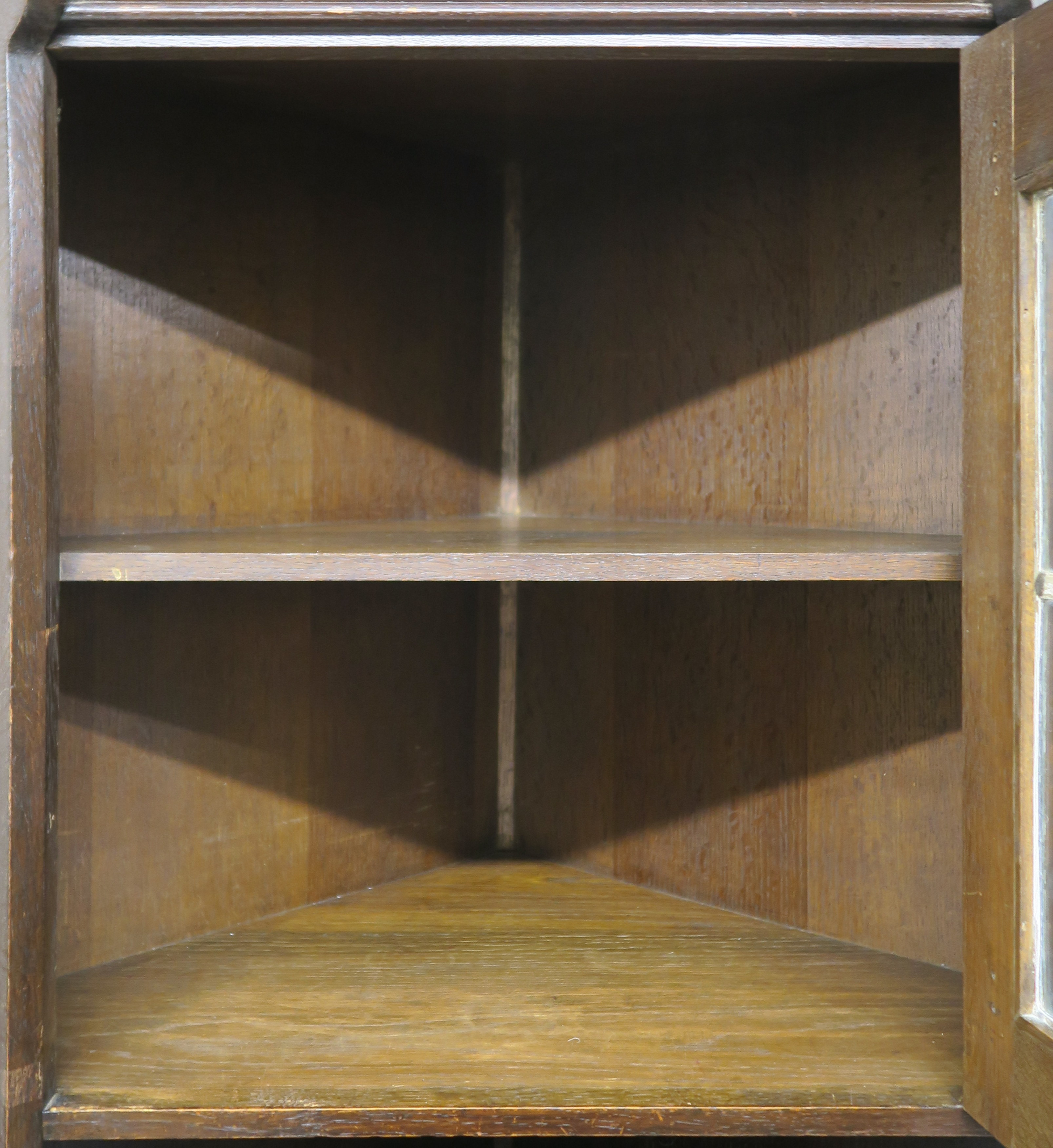 A Liberty & Co oak corner cabinet, the upper section having leaded glazed door over open shelf on - Image 4 of 8