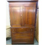 A Victorian mahogany linen press with two doors over four drawers, 226cm high x 130cm wide x 62cm