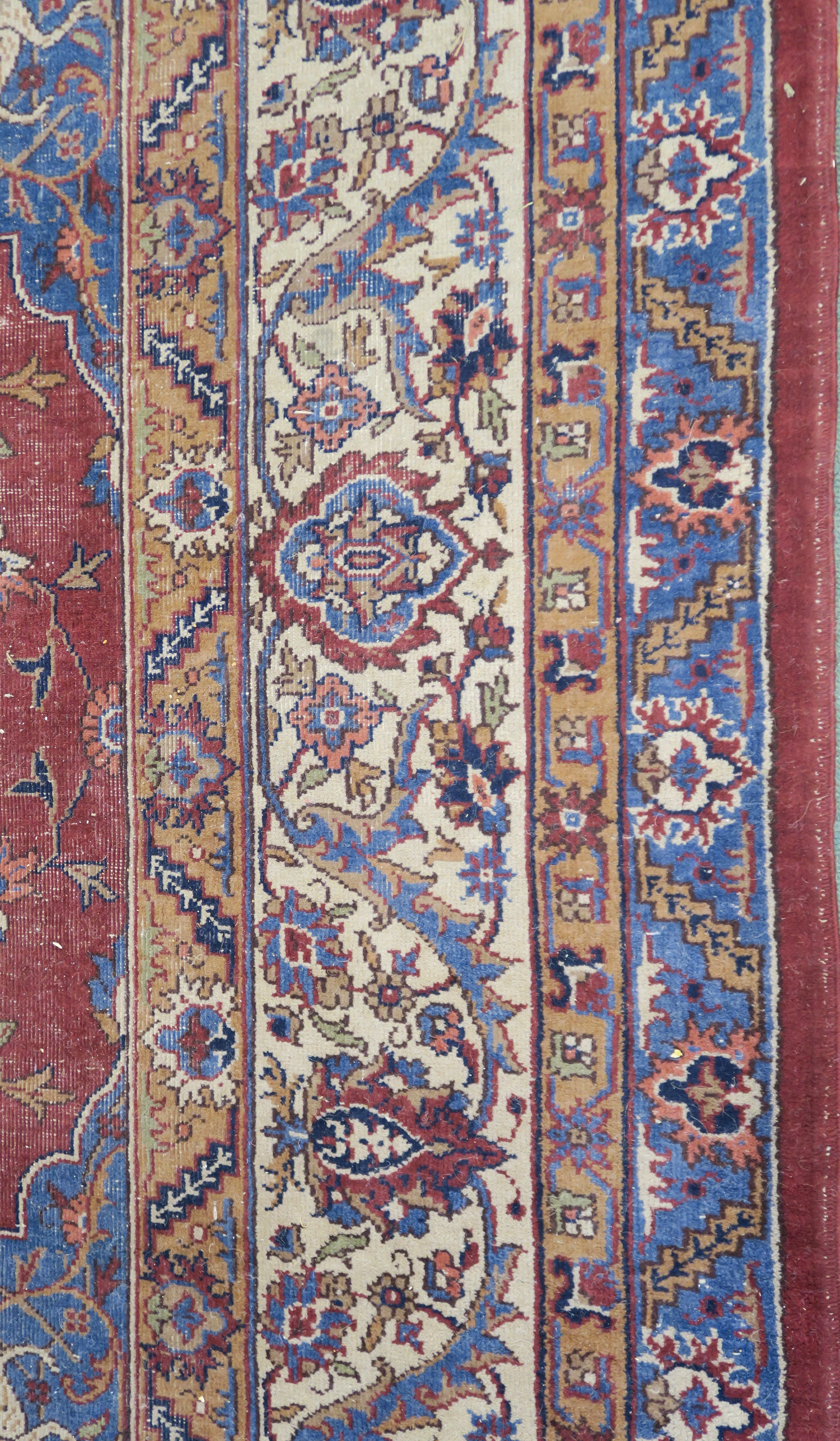 A large Turkish tabriz rug, red ground with central medallion and spandrels with animals and birds - Image 6 of 8