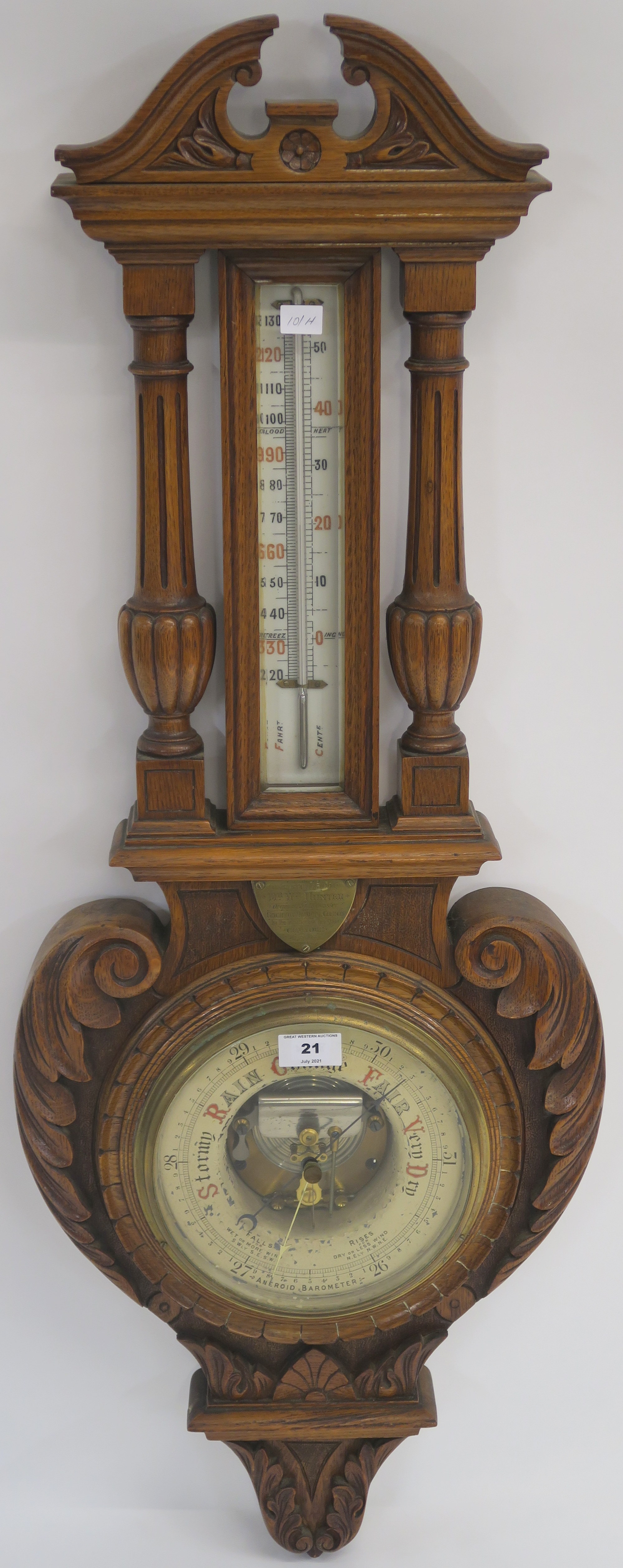 A Victorian carved oak thermometer/barmometer, 101cm high Condition Report: Available upon request