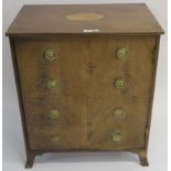 A reproduction walnut cabinet with single door and brass handles, 79cm high x 68cm wide x 46cm