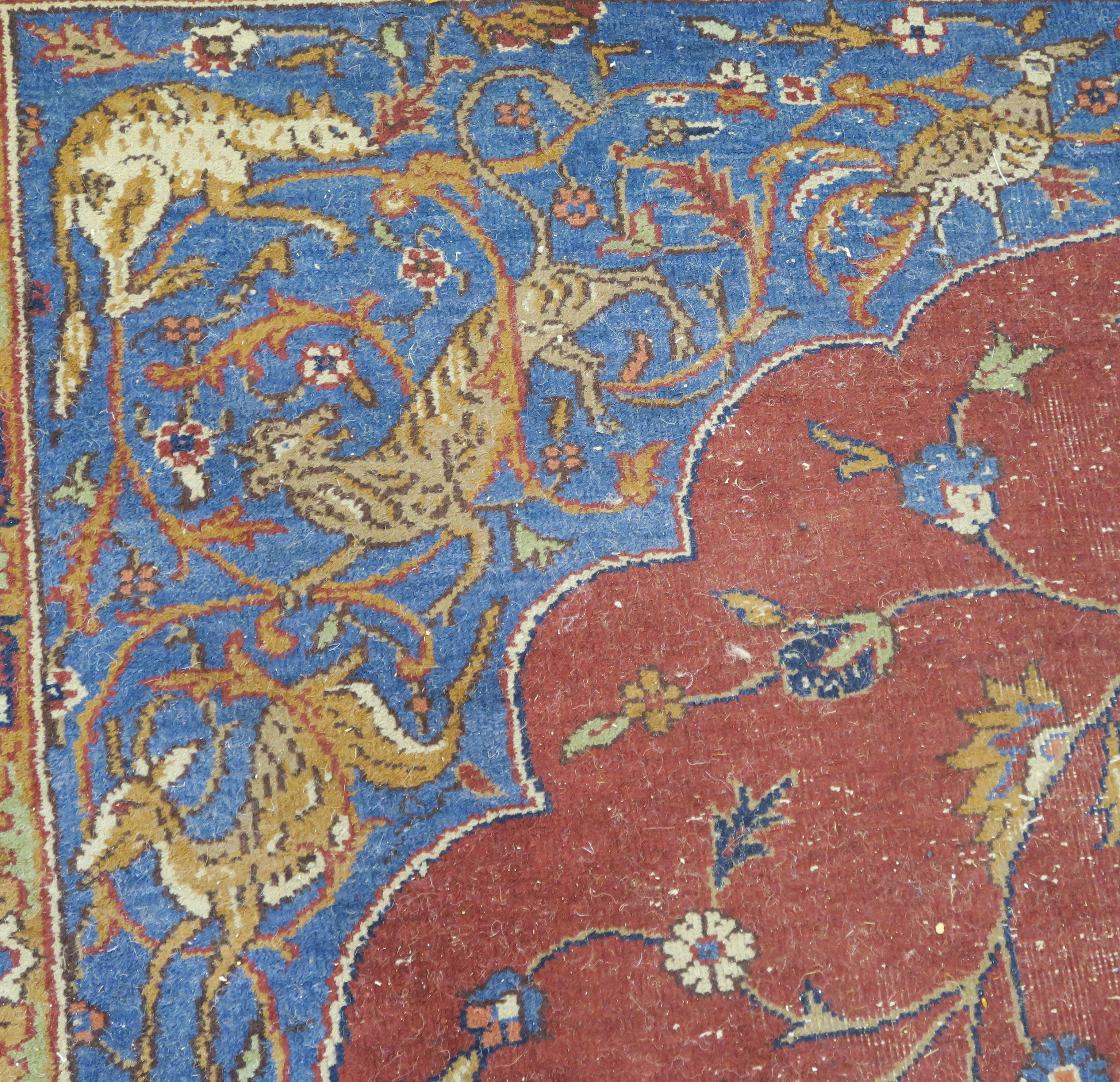 A large Turkish tabriz rug, red ground with central medallion and spandrels with animals and birds - Image 5 of 8