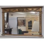 A gilt over mantle mirror, 58cm high x 87cm wide Condition Report: Available upon request