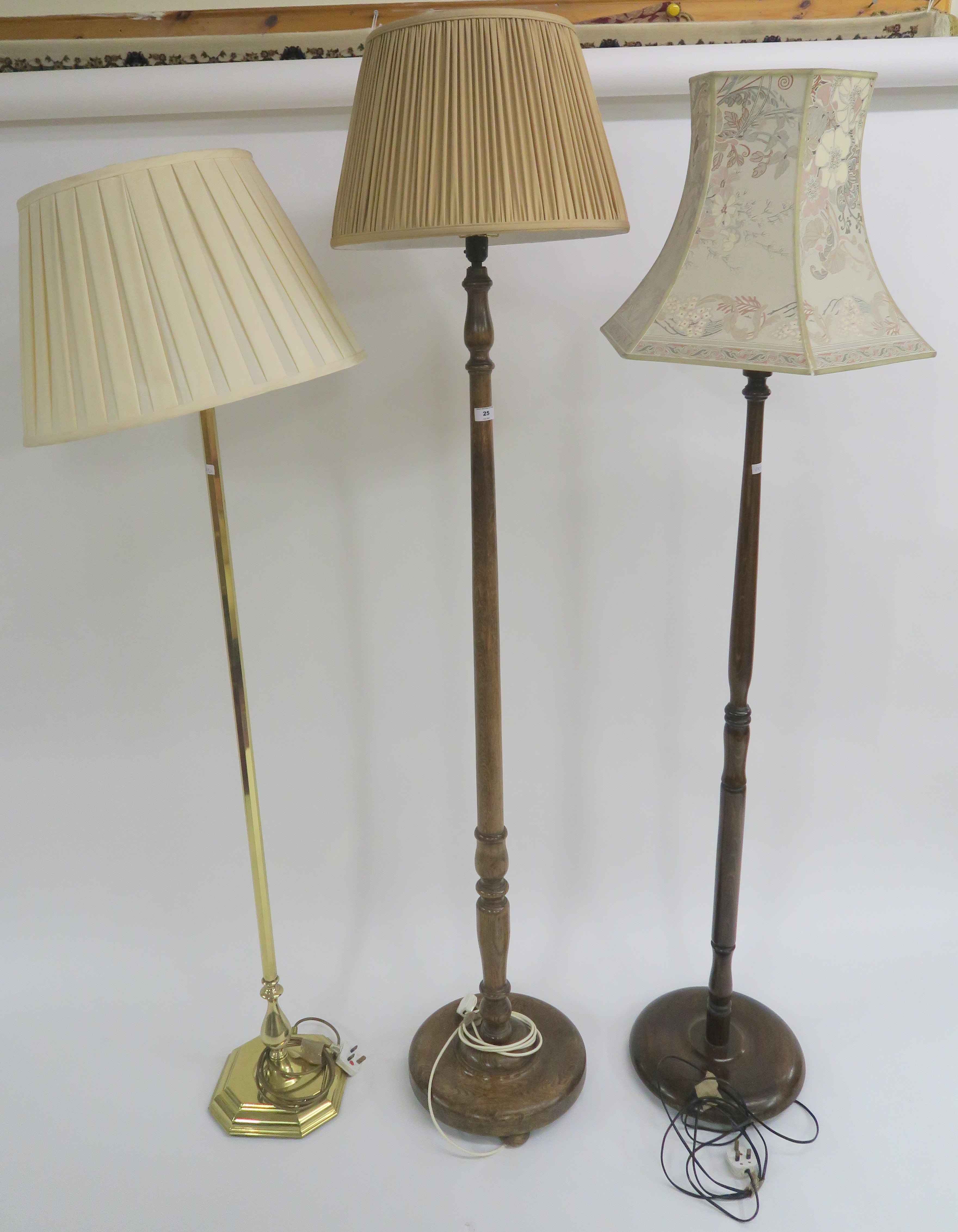 A modern brass standard lamp and two other standard lamps (3) Condition Report: Available upon