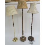 A modern brass standard lamp and two other standard lamps (3) Condition Report: Available upon