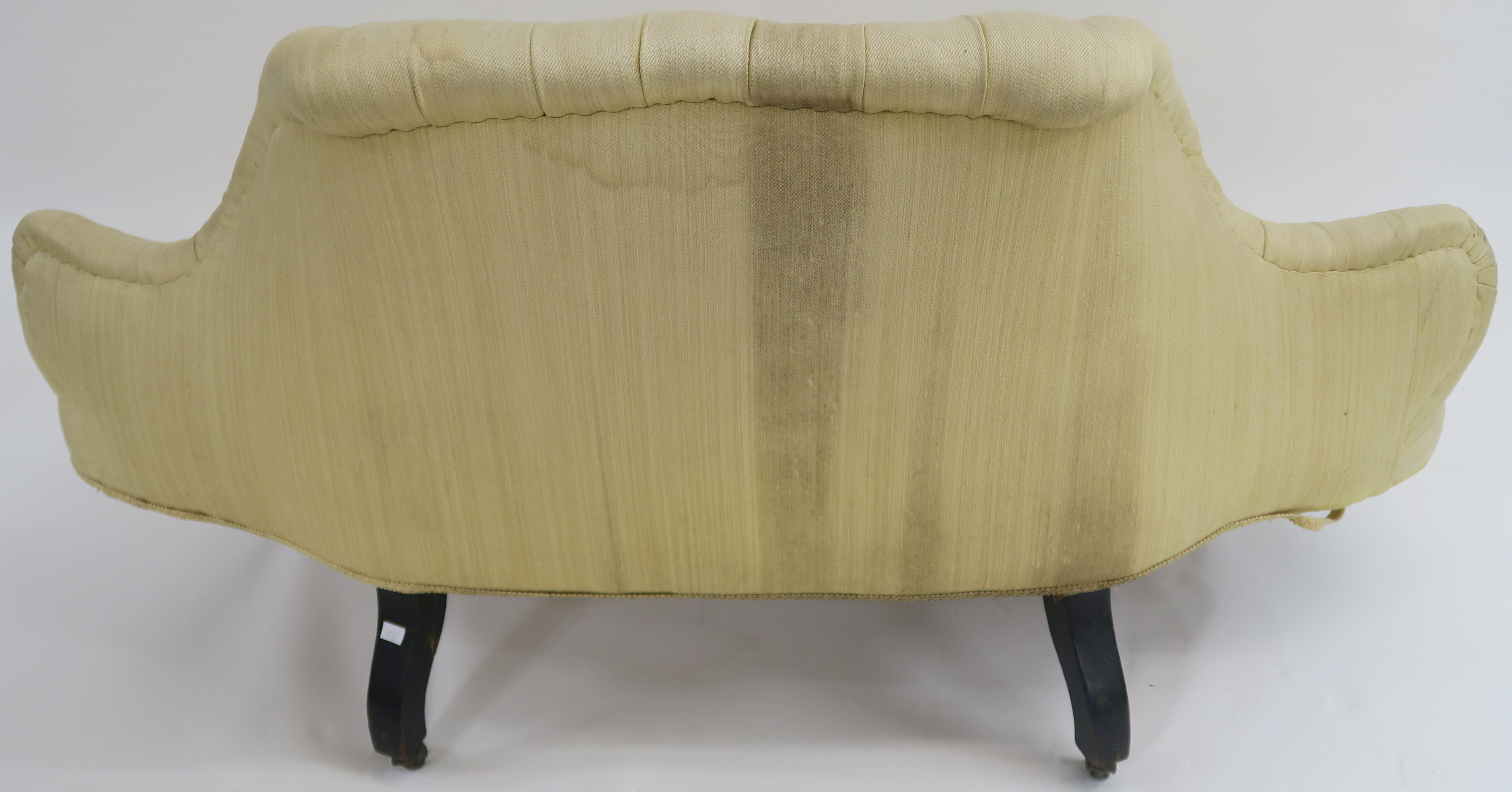 A Victorian button back sofa with shaped back on ebonised legs with ceramic castors, 75cm high x - Image 5 of 5