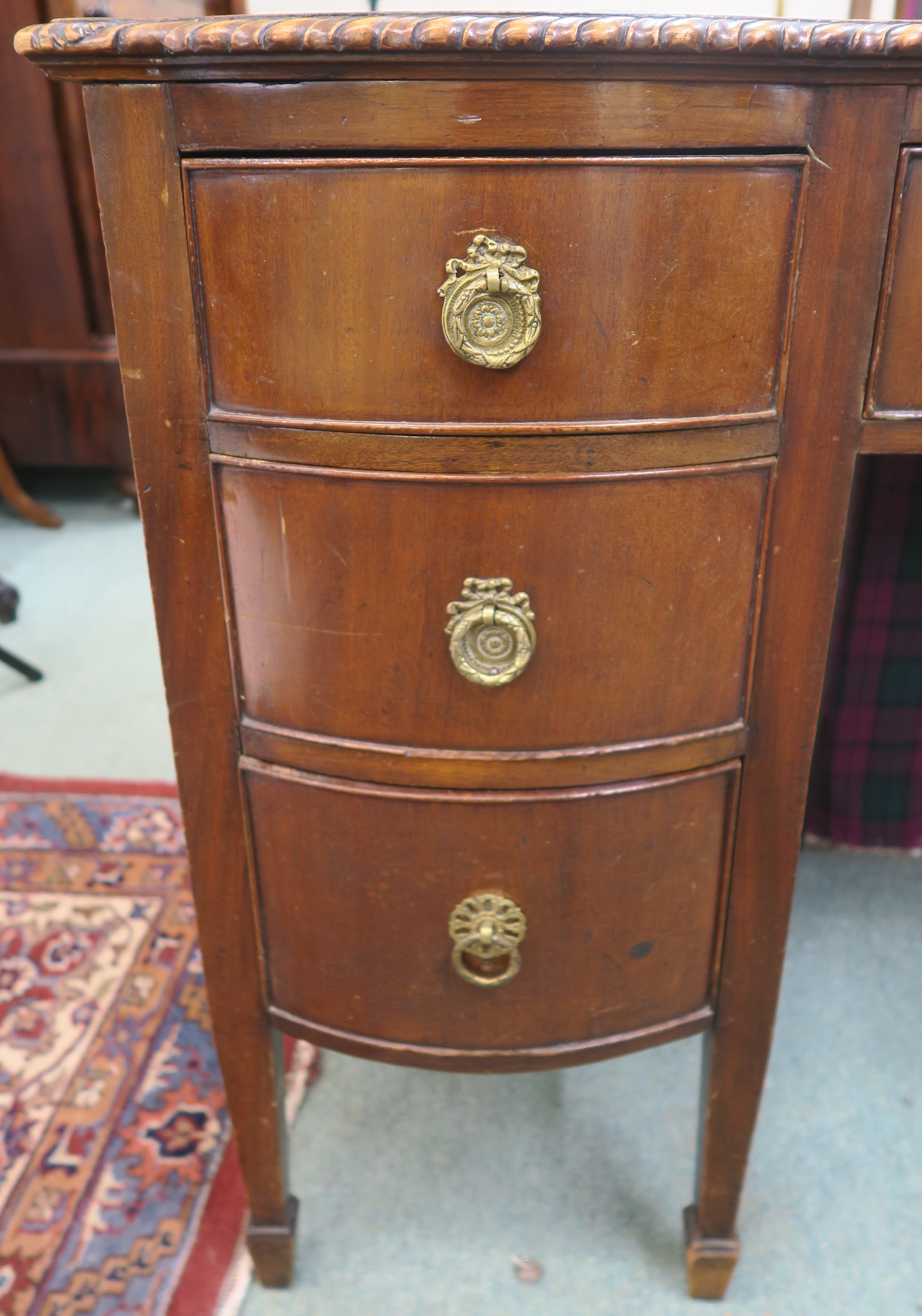 A mahogany writing desk with rexine skiver with central drawer flanked by six bow front drawers on - Image 3 of 3