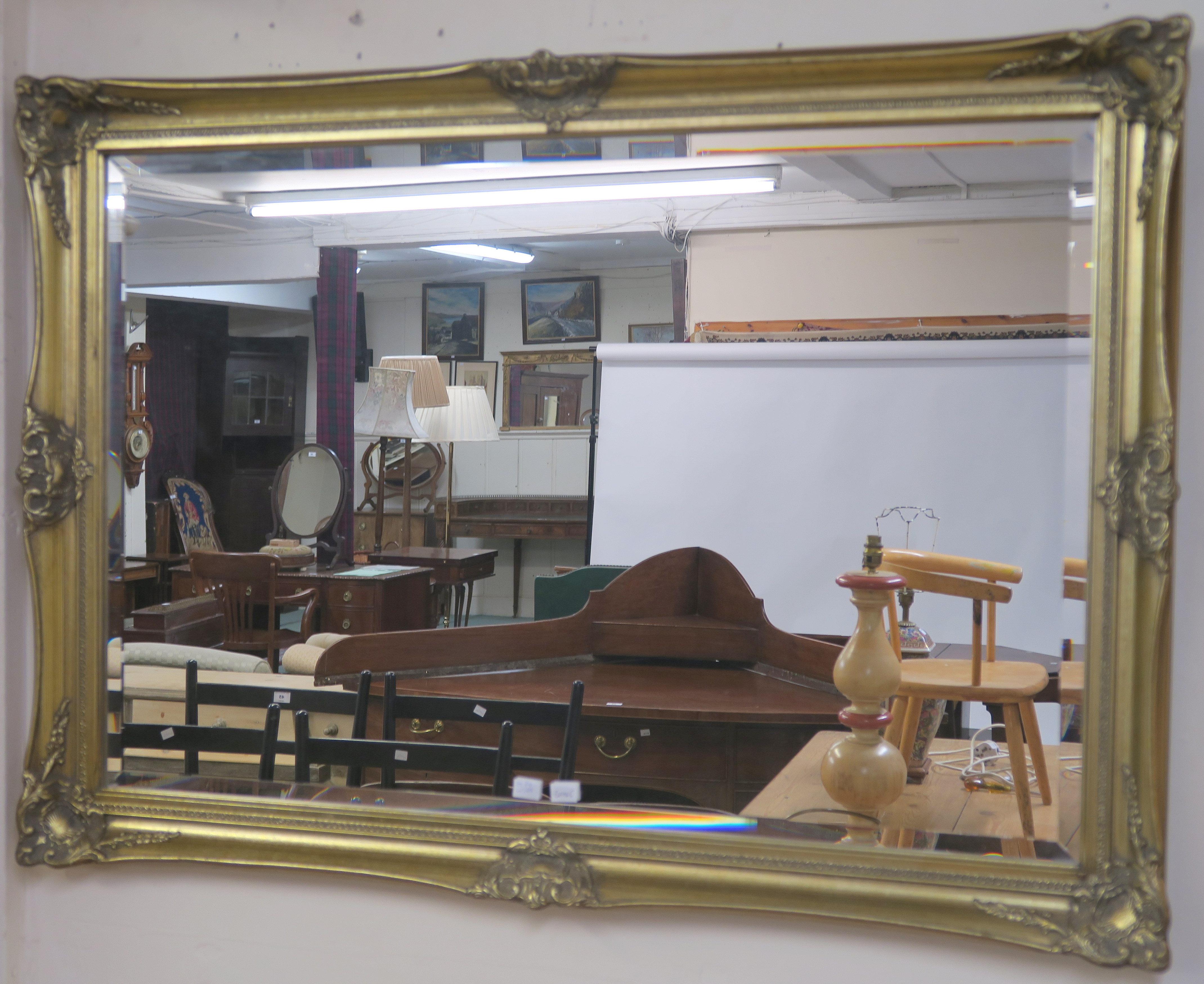 A gilt wall mirror, 71cm x 84cm and another gilt wall mirror, 74cm x 105cm (2) Condition Report: - Image 2 of 3