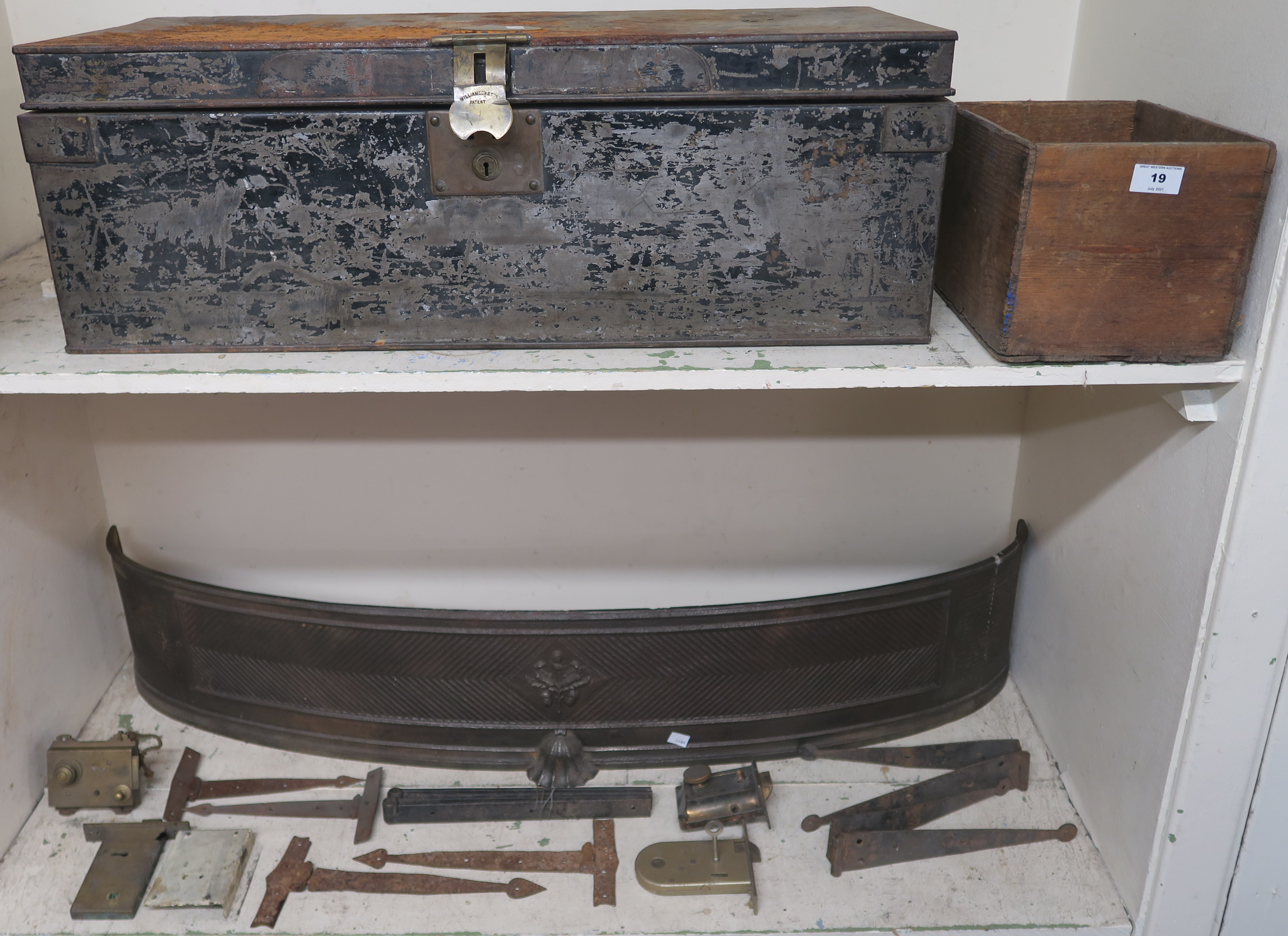 A cast iron bow front fender, 23cm high x 120cm wide. A metal deed box and a selection of locks