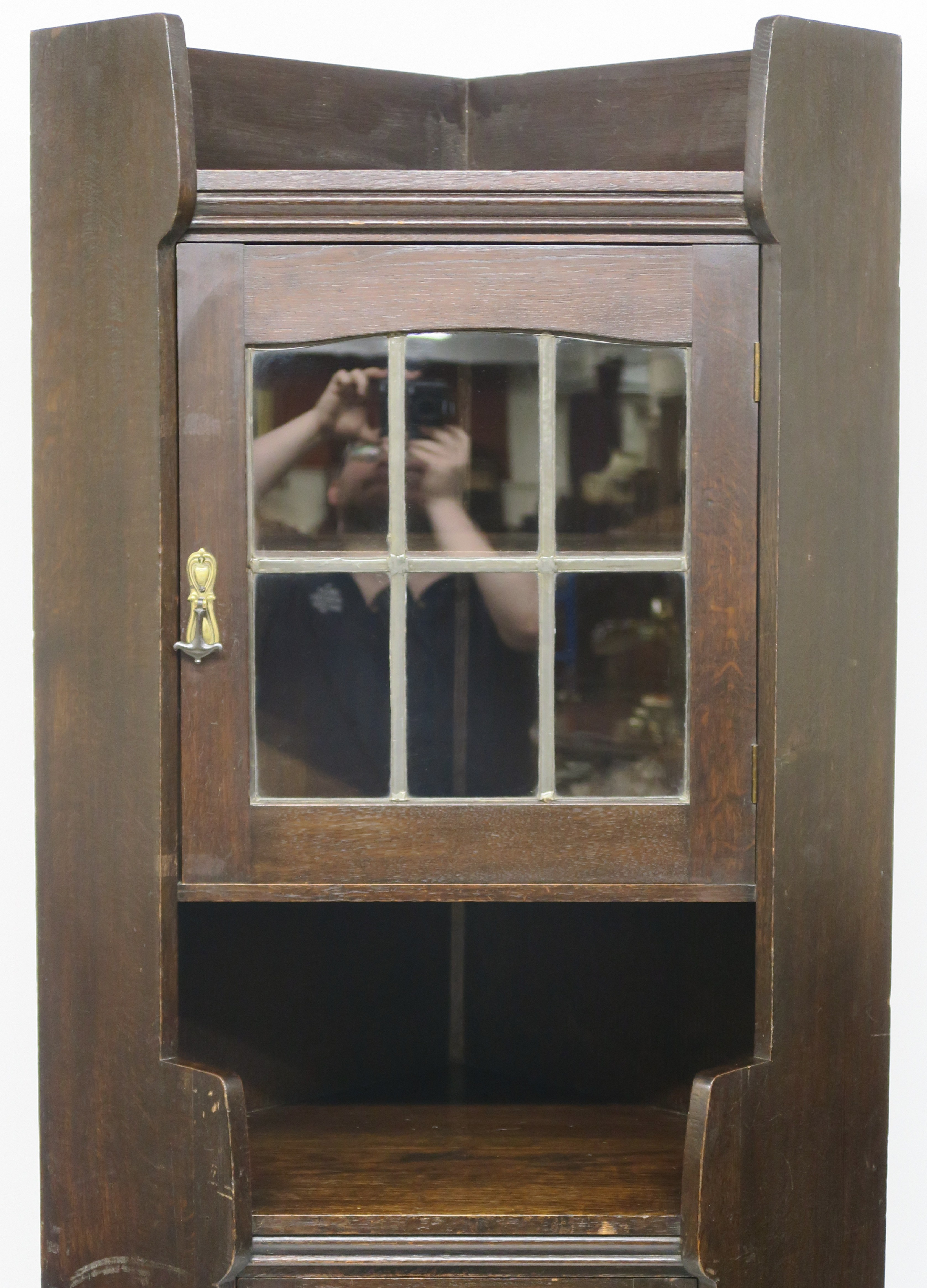 A Liberty & Co oak corner cabinet, the upper section having leaded glazed door over open shelf on - Image 2 of 8