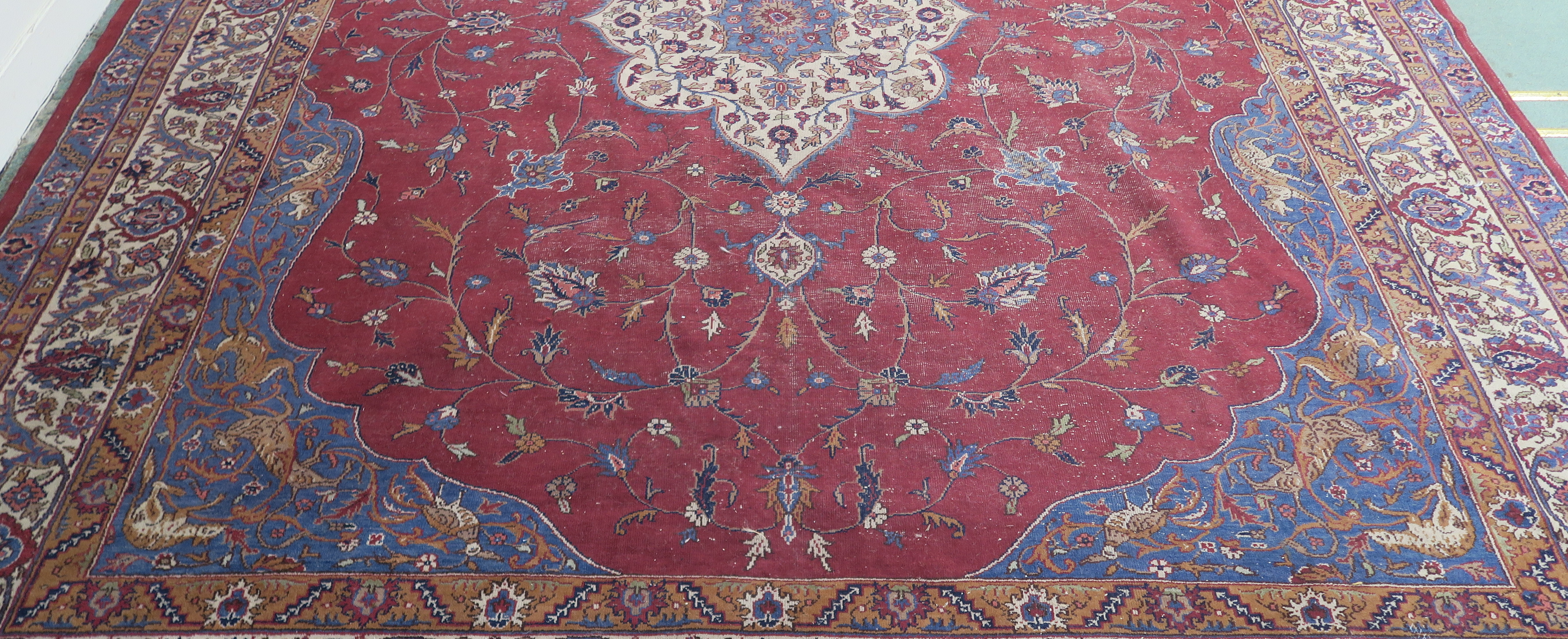 A large Turkish tabriz rug, red ground with central medallion and spandrels with animals and birds - Image 3 of 8