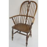 An ash Windsor armchair with pierced back slat, 108cm high Condition Report: Available upon request