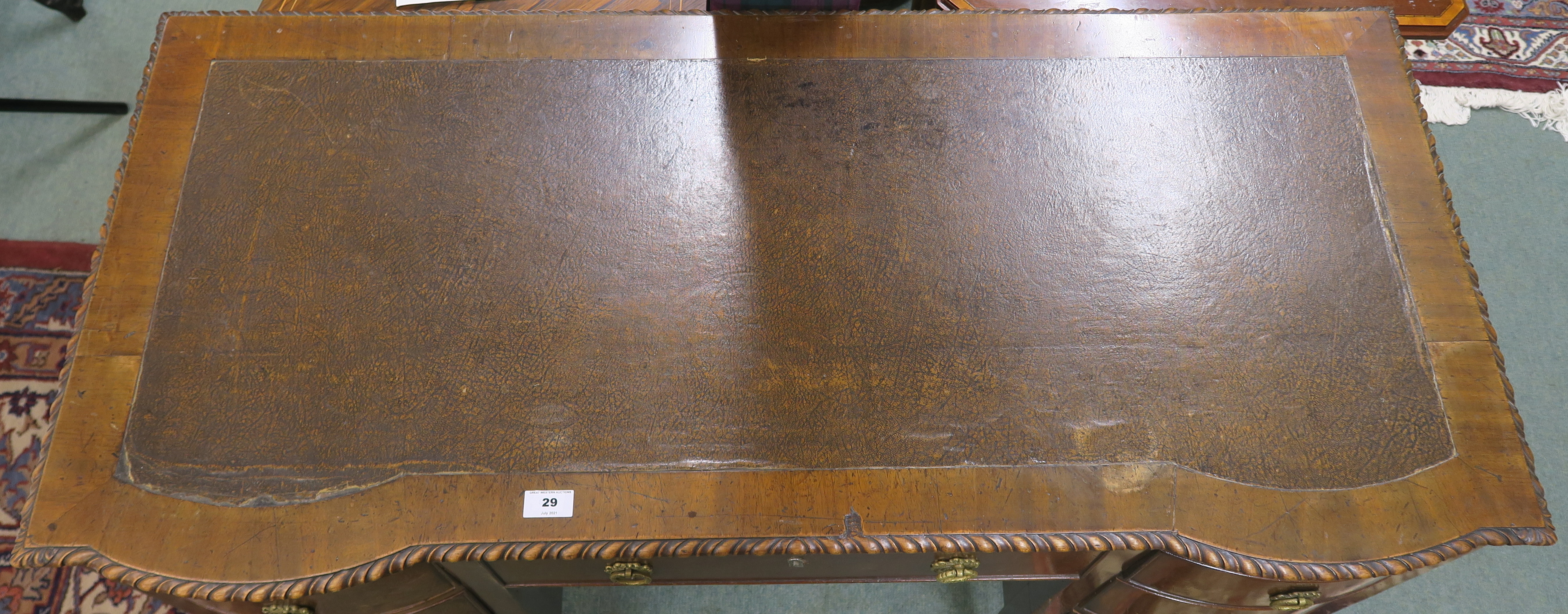 A mahogany writing desk with rexine skiver with central drawer flanked by six bow front drawers on - Image 2 of 3