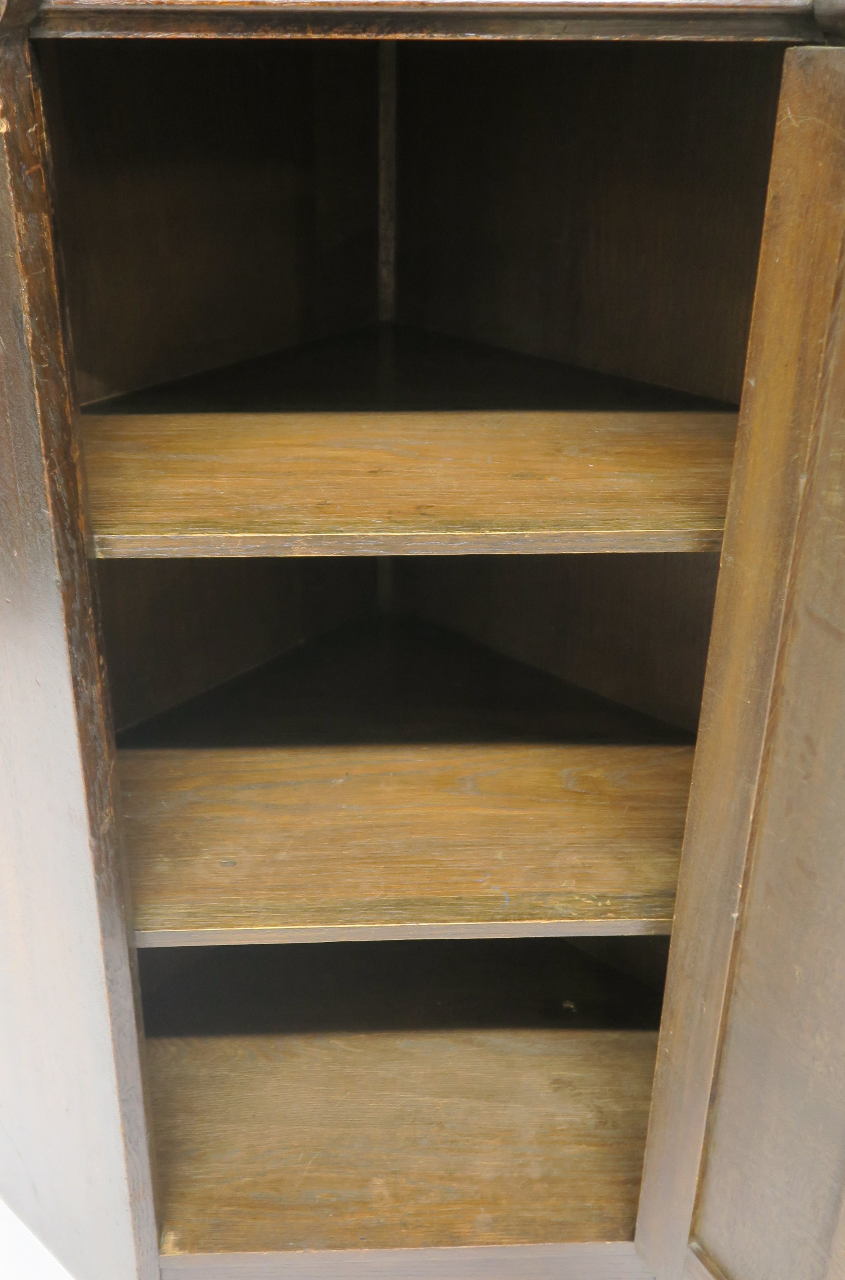 A Liberty & Co oak corner cabinet, the upper section having leaded glazed door over open shelf on - Image 6 of 8