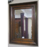 A Victorian walnut wall mirror with replacement glass, 70cm x 49cm Condition Report: Available