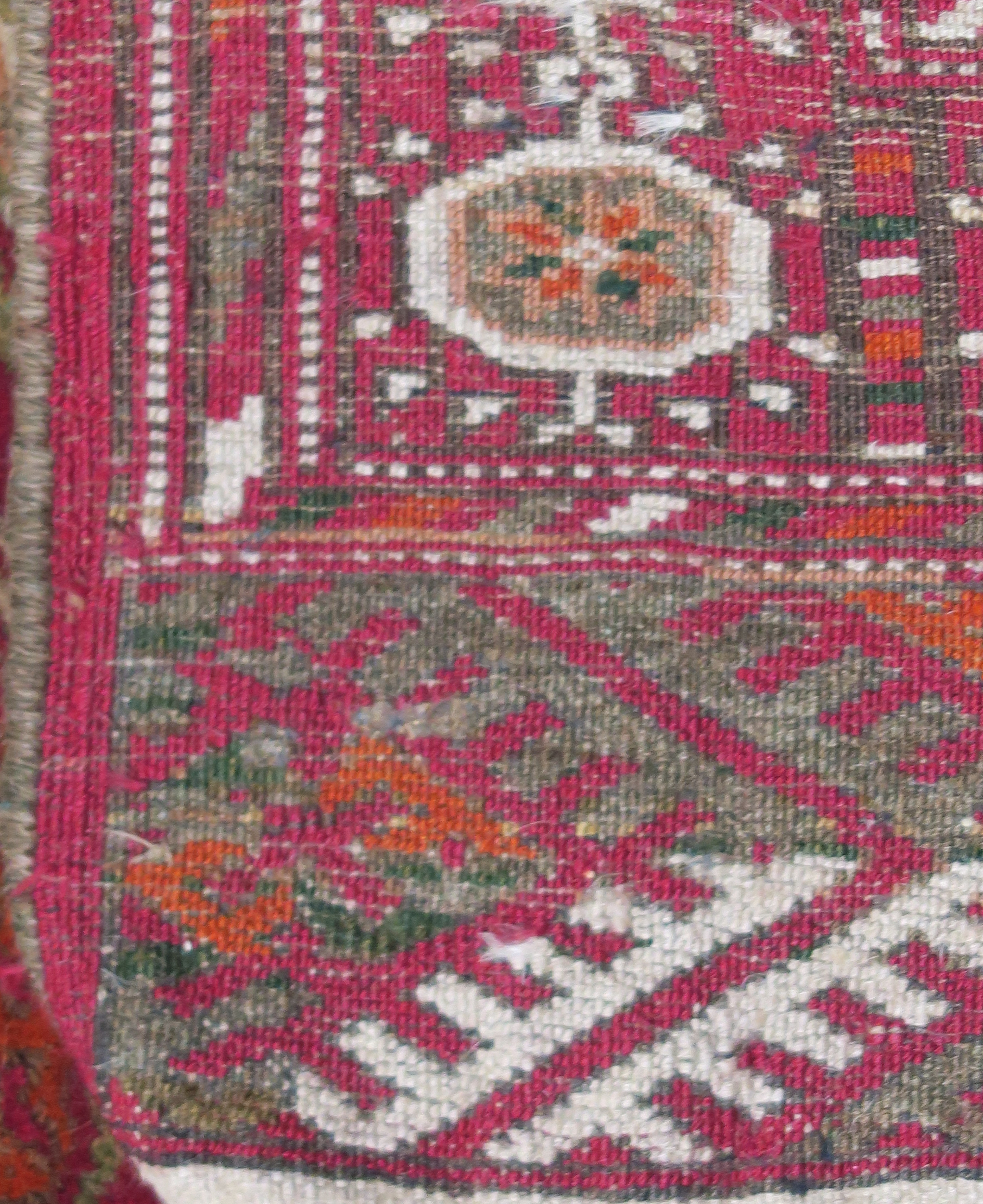 A red ground Turkeman style rug, 114cm x 80cm Condition Report: Available upon request - Image 3 of 3
