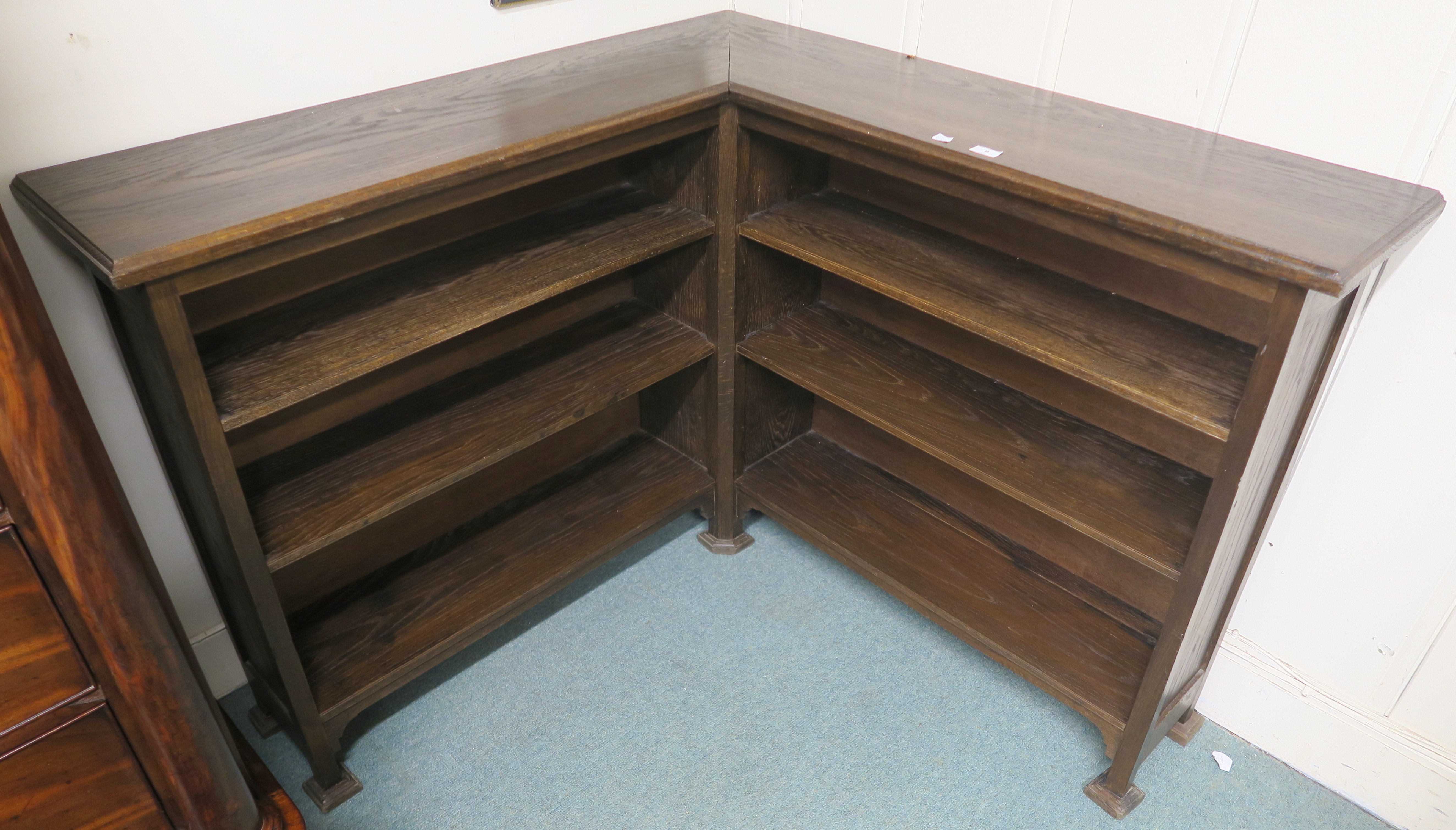 An oak open corner bookcase, 94cm high x 122cm wide x 122cm deep Condition Report: