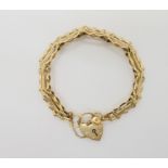 A 9ct gold gate bracelet with heart shaped clasp, weight 10.5gms Condition Report: Available upon