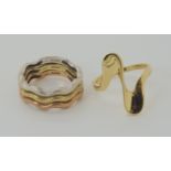 Three 9ct red, yellow and white gold wave stacking rings size N, and a 9k dress ring size O,