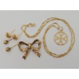 A 9ct bow brooch 3cm x 2.5cm, a 9ct Maltese cross and chain, and two pairs of stud earrings,