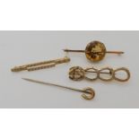 A 9ct gold citrine set bar brooch diameter of the citrine 15.7mm, a 9ct horse and horse shoe