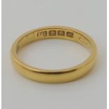 An 18ct gold wedding ring with Glasgow hallmarks dated 1908, size S, weight 4.7gms Condition Report: