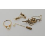 A 9ct pearl set flower brooch, a pearl set ring and stickpin, and a further 9ct garnet set brooch,